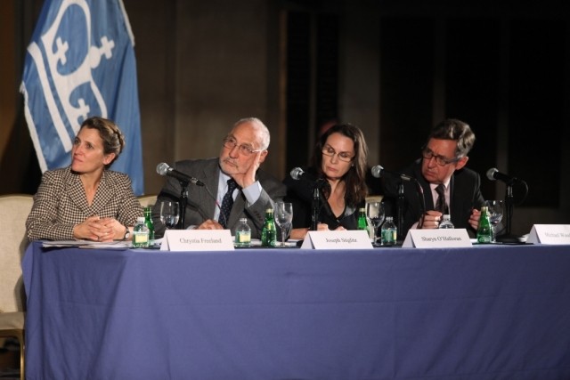 Moderator Chrystia Freeland and panelists Joseph Stiglitz, Sharon O’Halloran, and Michael Woodford, address the economic advisors and pose questions from the audience for discussion.