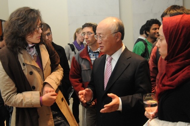 Director General Amano interacts with guest at the post-event reception.