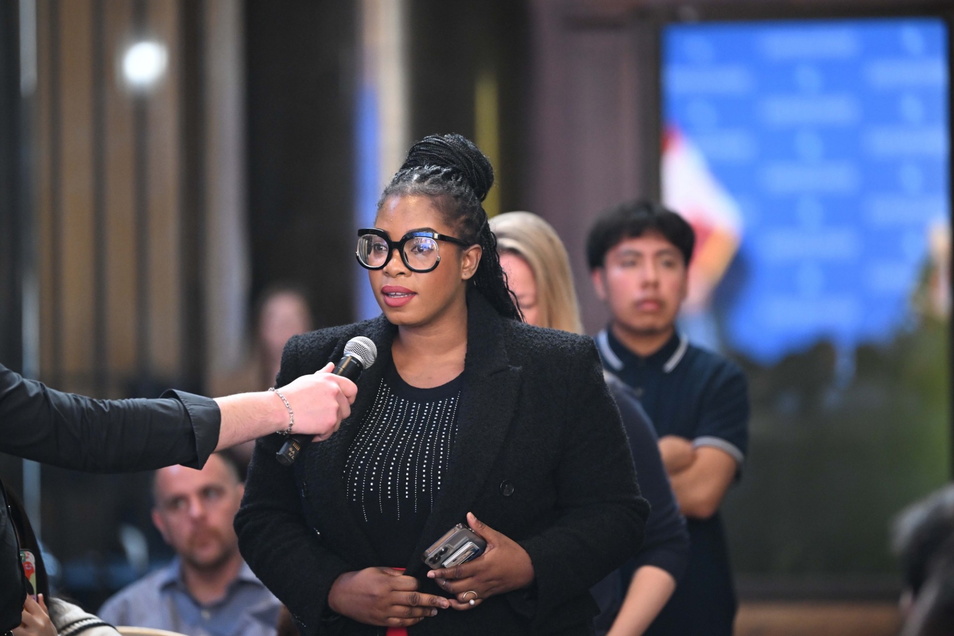 A Columbia University student asks a question during the World Leaders Forum event Q&A