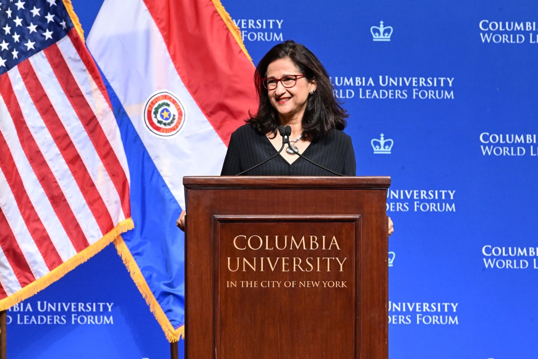 Columbia University President Minouche Shafik speaking at the podium during the World Leaders Forum