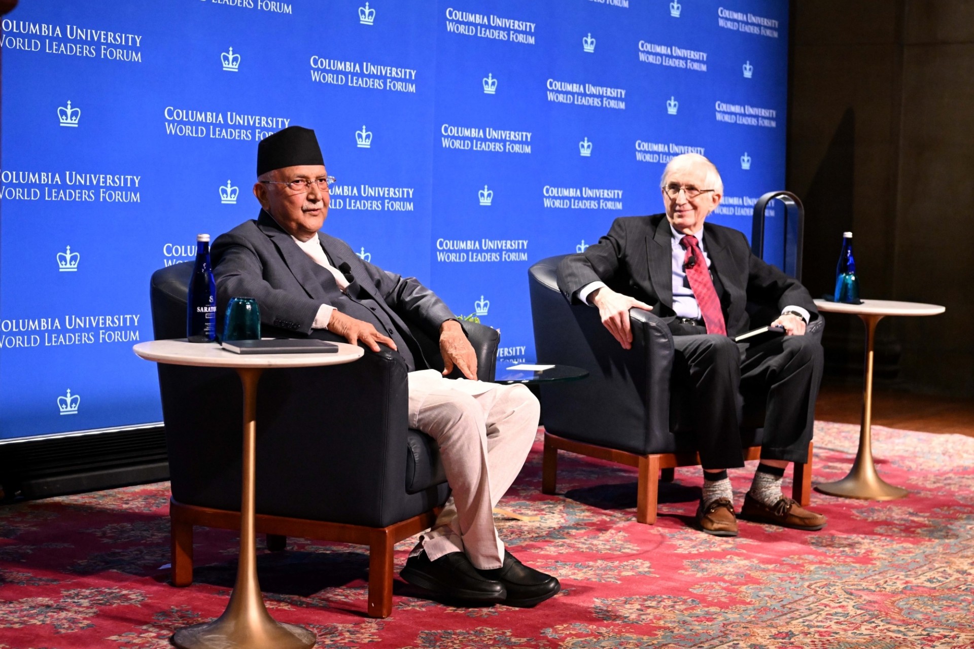 Prime Minister of Nepal and Moderator Jenik Radon engaging in discussion.