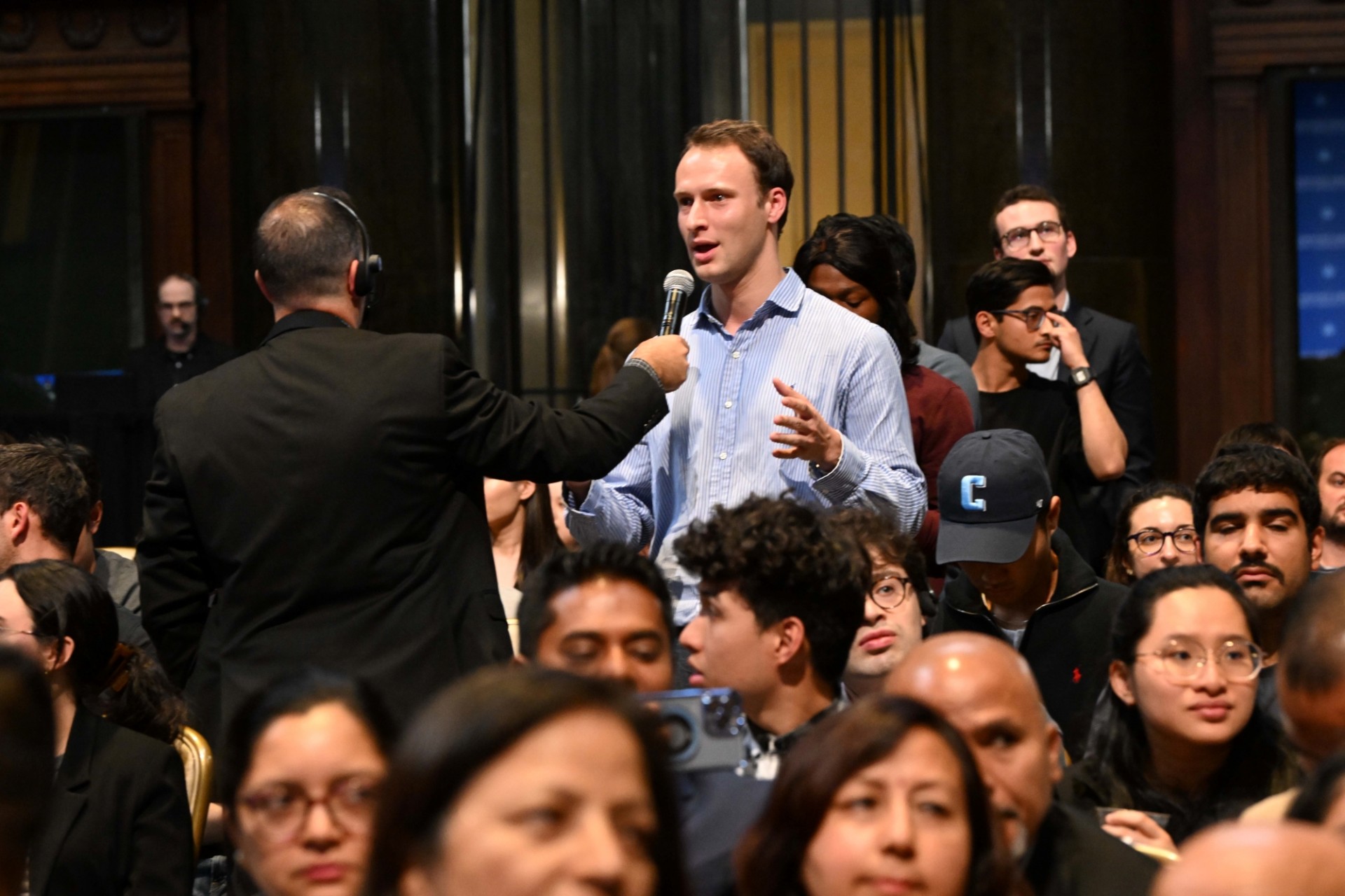 Student asking questions to the Prime Minister of Nepal.