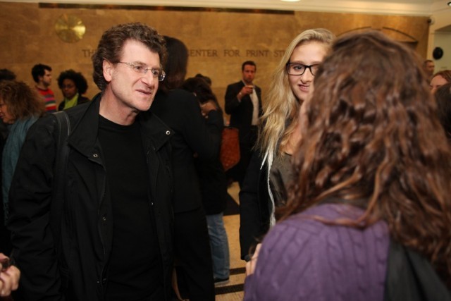 Alfredo Jaar mingles with students at a reception after his program. 