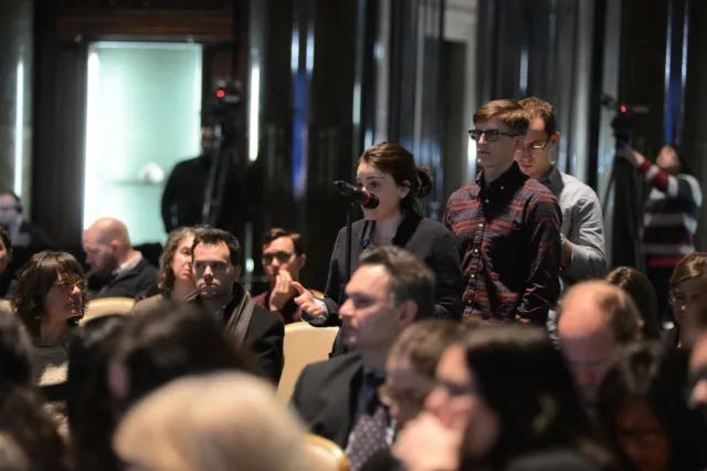 Columbia University students and audience members line up to ask the panelists a question during the question and answer session. 