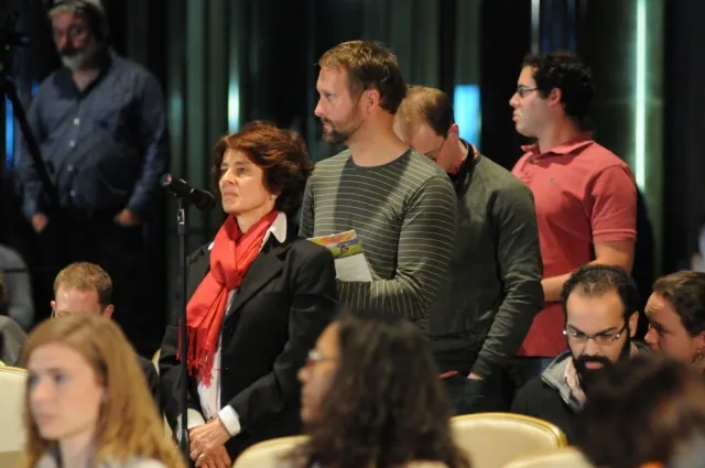 Columbia University students and community members line up to participate in a question and answer session with the panelists.