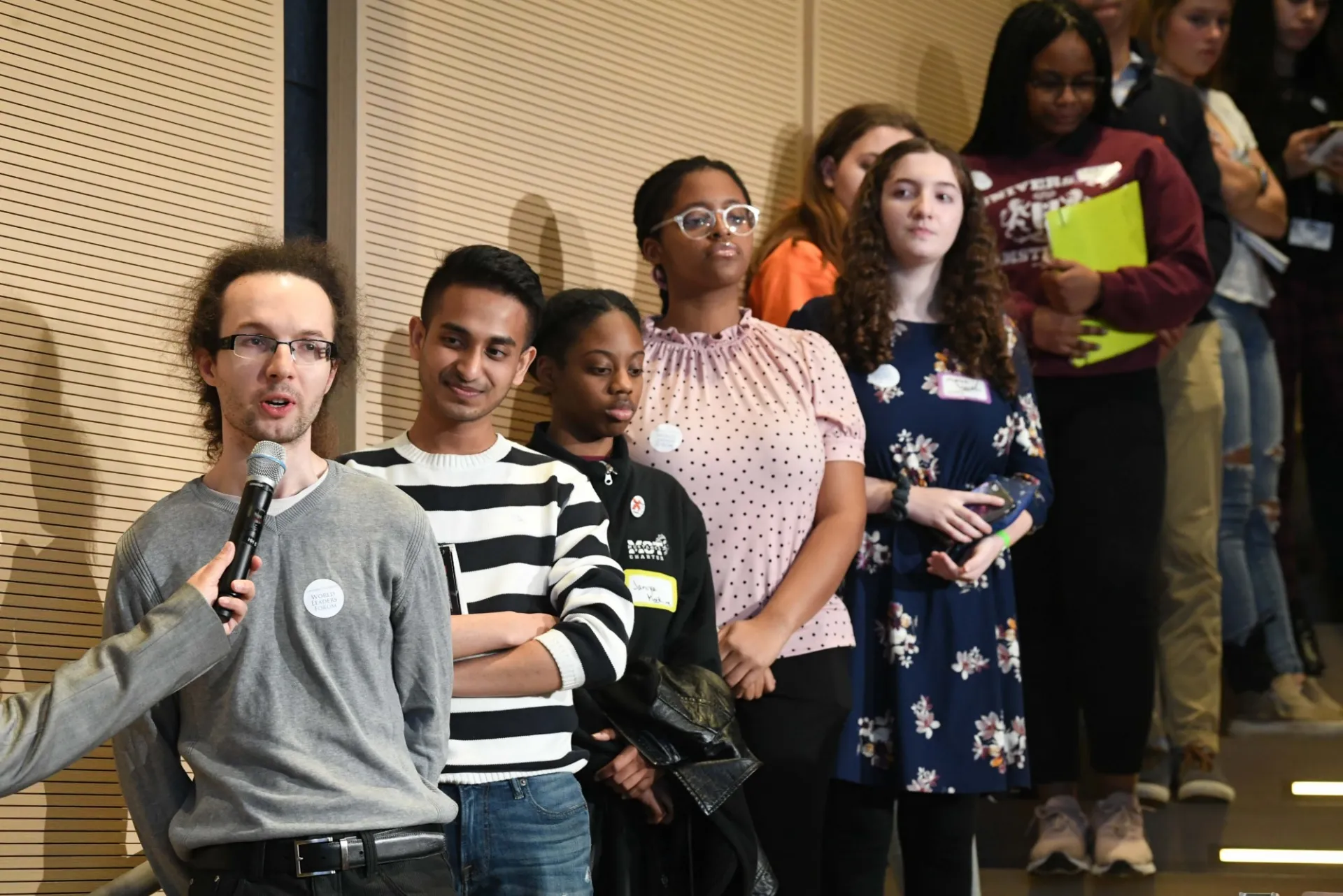 Columbia University students line up to ask Prime Minister Ms. Sanna Marin a question during the question and answer session.