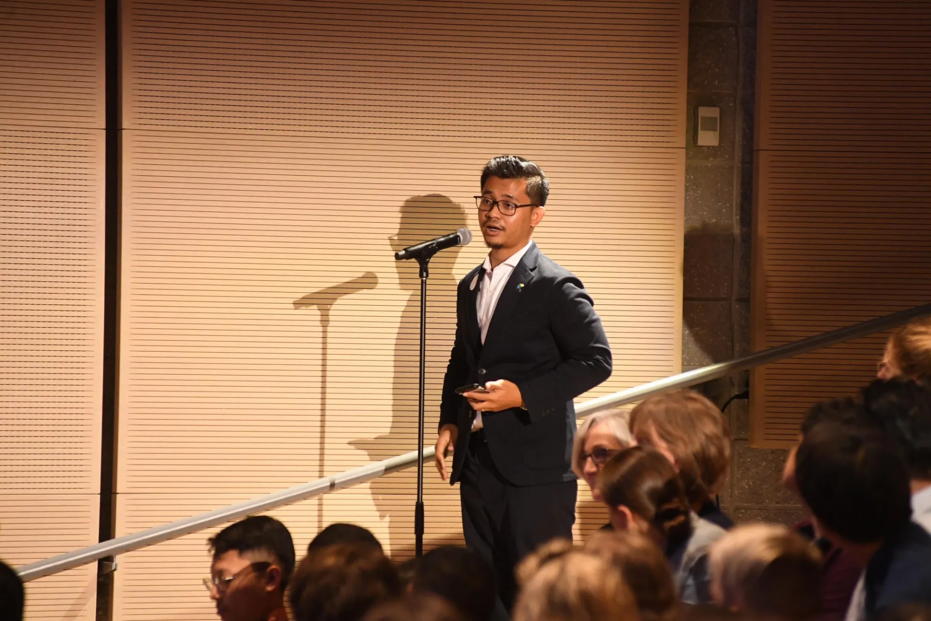 Columbia University students line up to ask the panelists questions during the question and answer session.