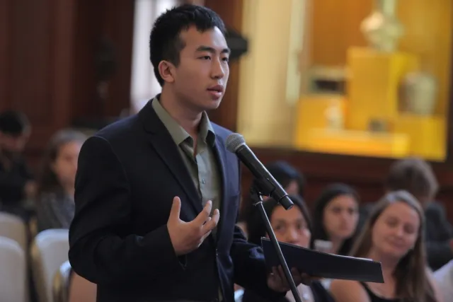 Columbia University student asks the panel a questions during the question and answer session.