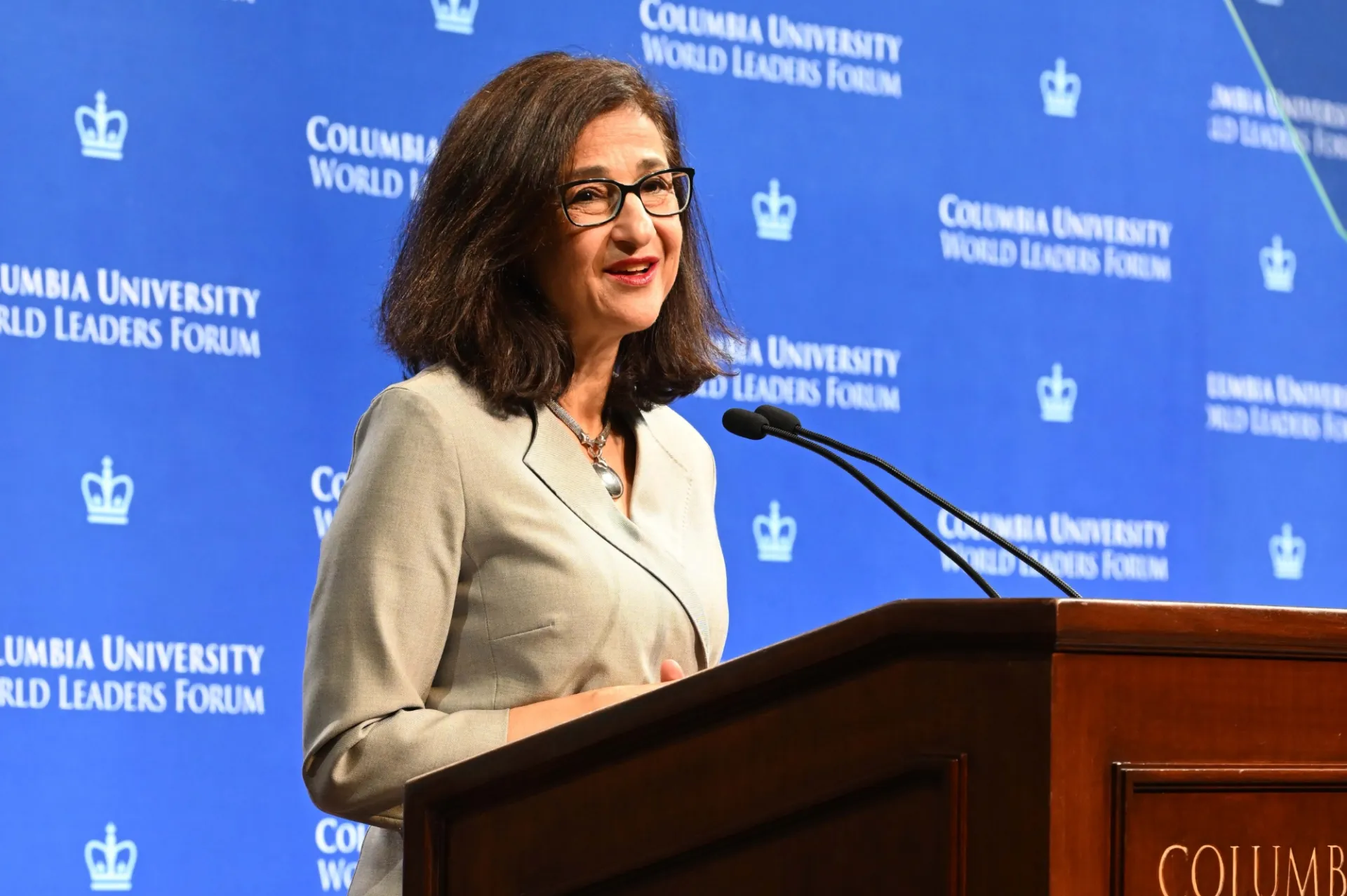 Columbia University President Minouche Shafik speaking at the podium during the World Leaders Forum
