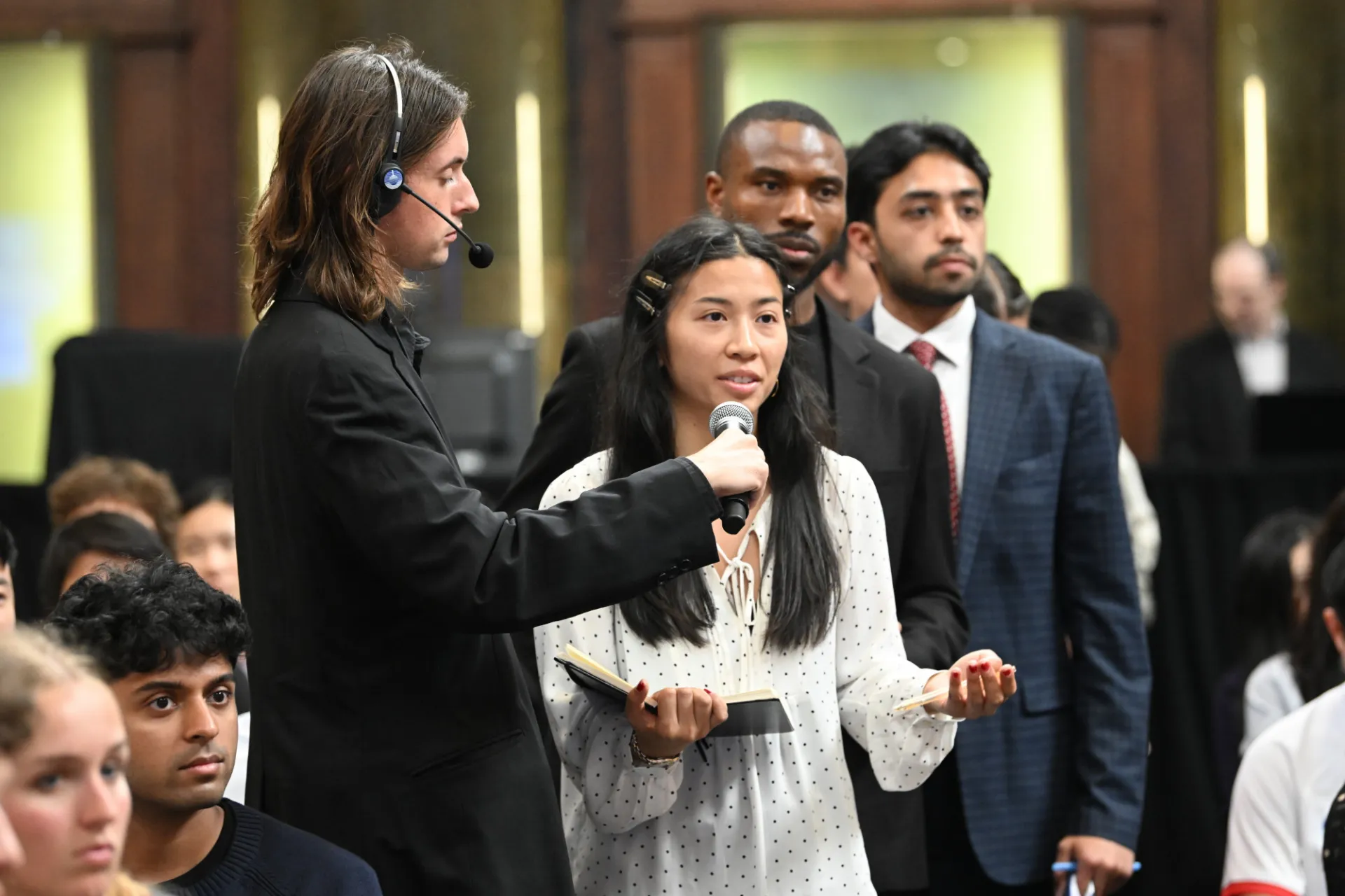 Student asking a question during the live Q&A portion of the program.