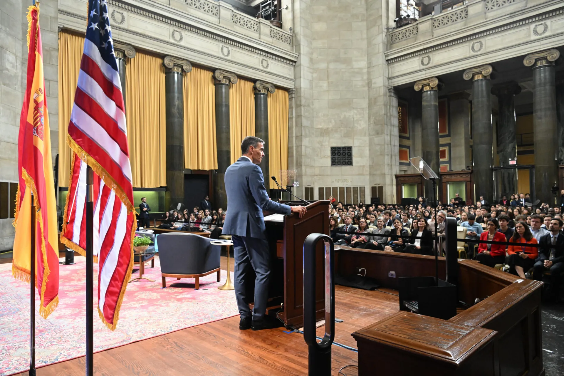 Pedro Sánchez, President of the Government of Spain, delivering his remarks at the podium with the audience in the background.