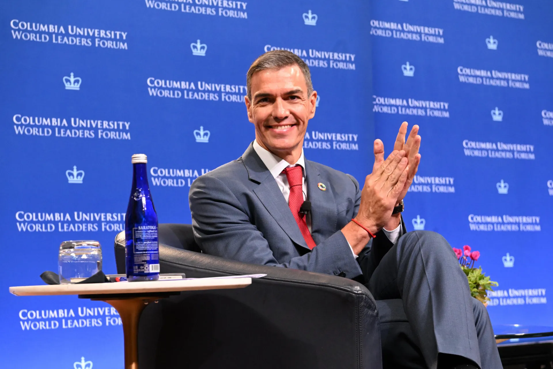 President Pedro Sánchez sitting on stage.