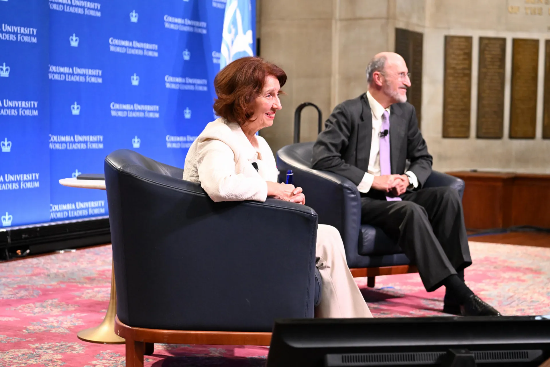 President Siljanovska-Davkova answering student question while sitting on stage.